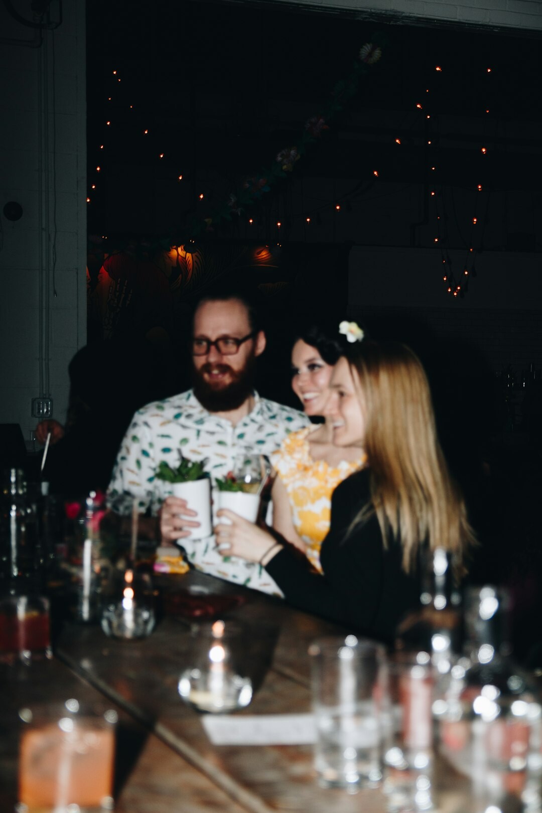 Small team of colleagues discussing around a table